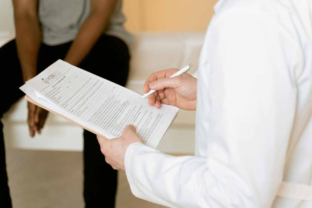 Man Holding Paperwork